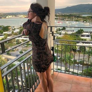 Long sleeved, backless dress.